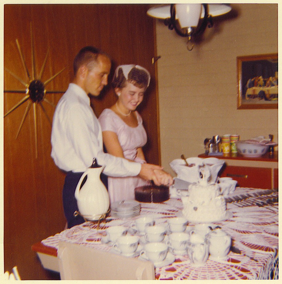 Marvin and Ann Waldrip cutting their wedding cake at the reception