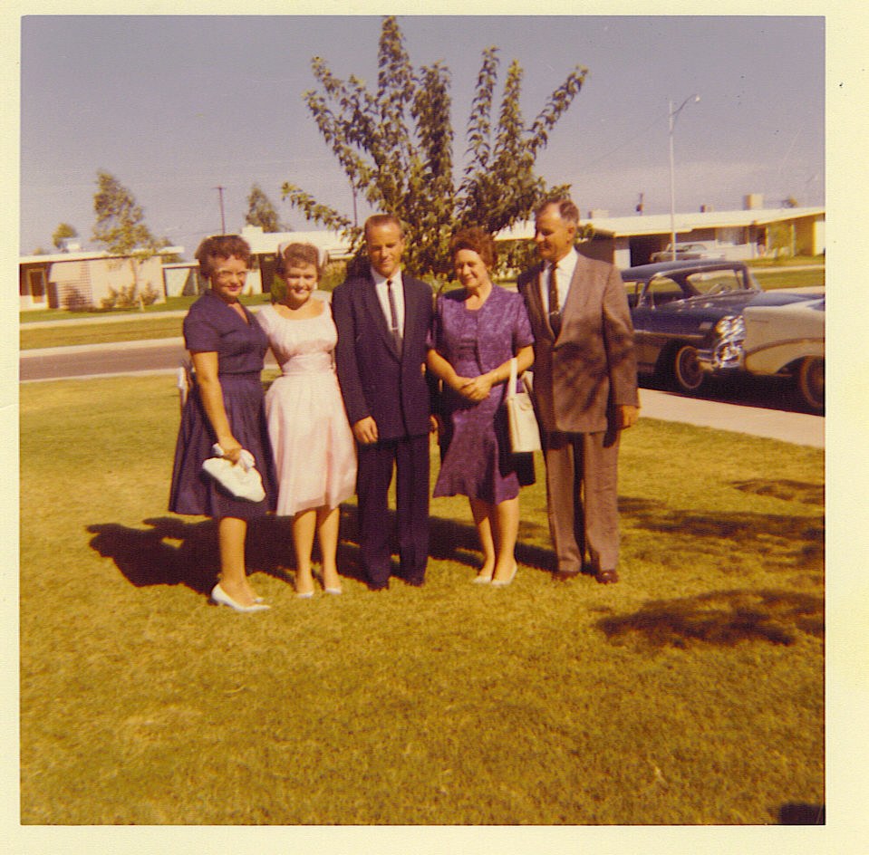 Marvin and Ann Waldrip with an older couple on a residential lawn
